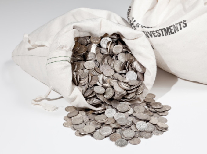 Linen bag of old pure silver coins used to invest in silver as a commodity