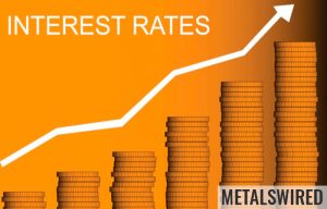 Ascending stacks of coins showing interests rates rising